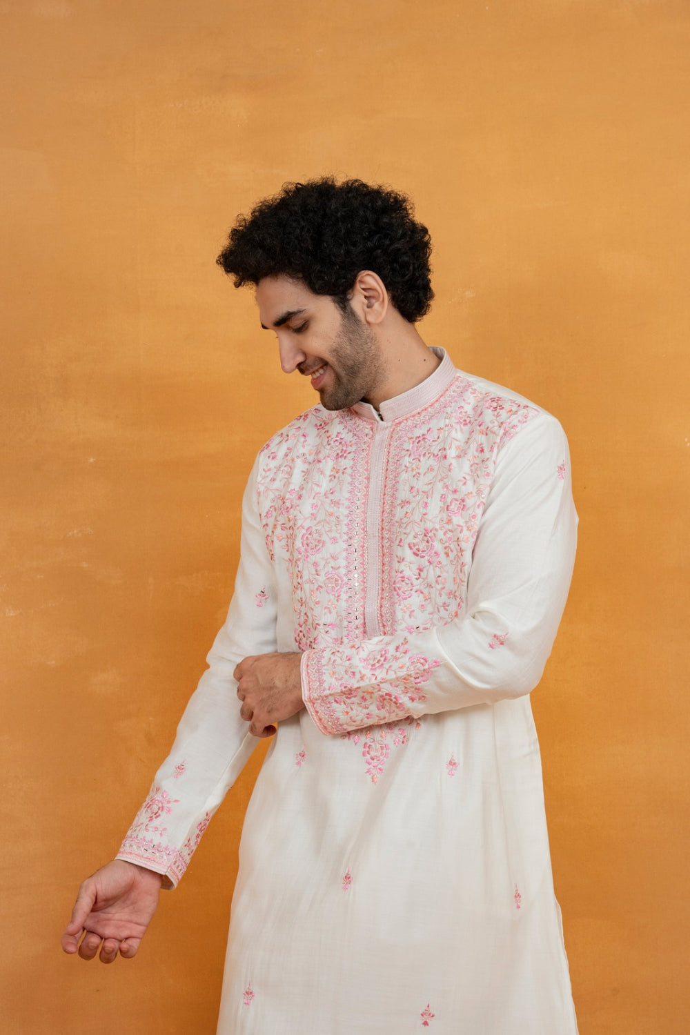 Cream silk kurta set with pink resham embroidery and mirror work