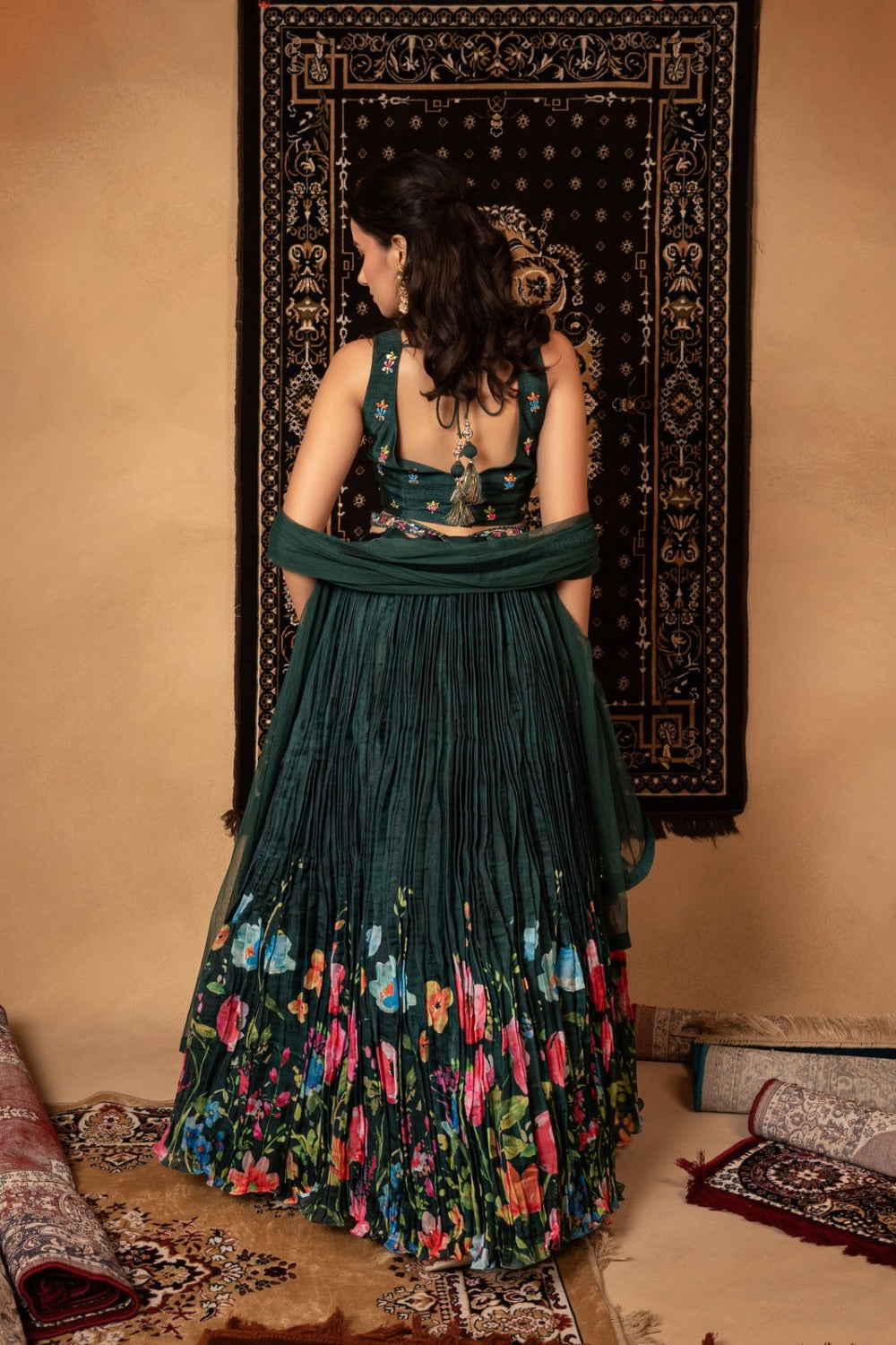 Dark green silk lehenga choli with resham and mirror work