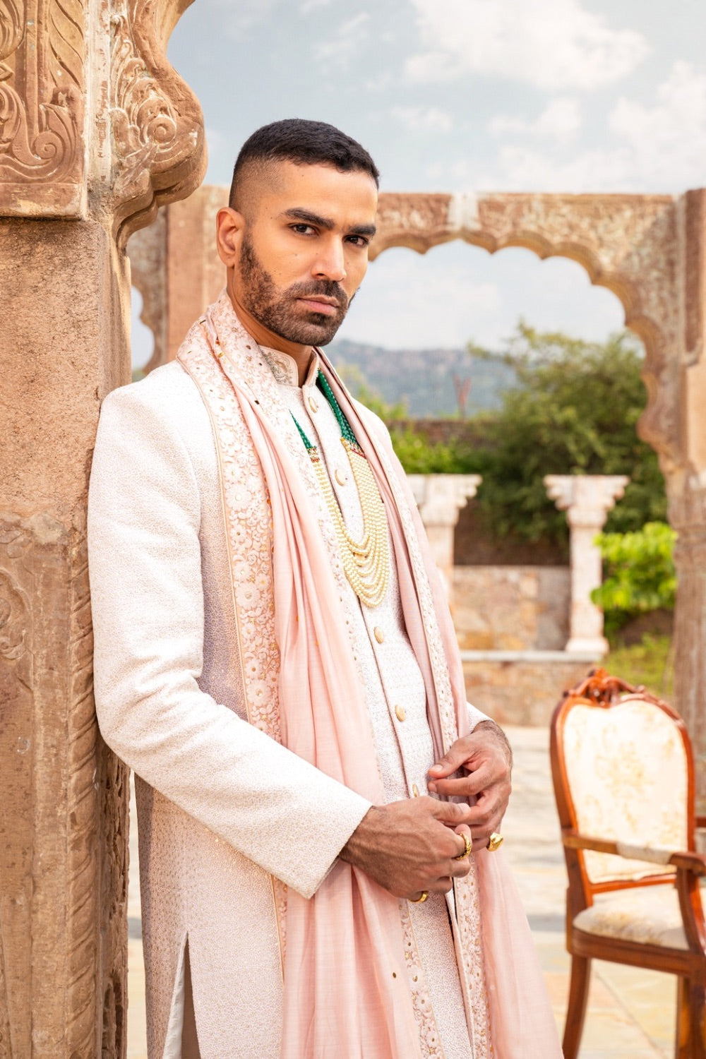 Cream silk sherwani with golden thread and resham work