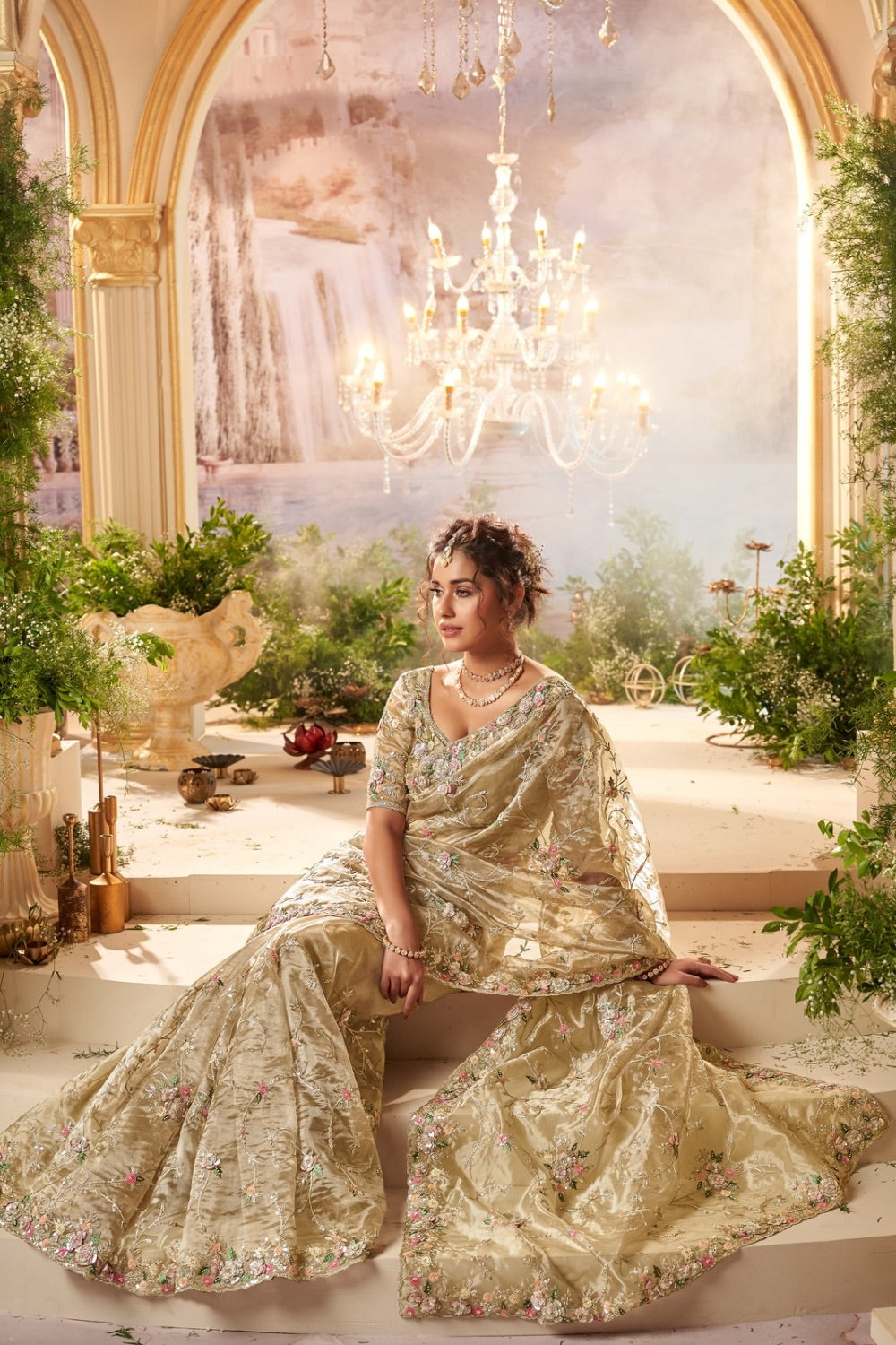 Champagne banarasi silk saree with matching unstitched blouse.