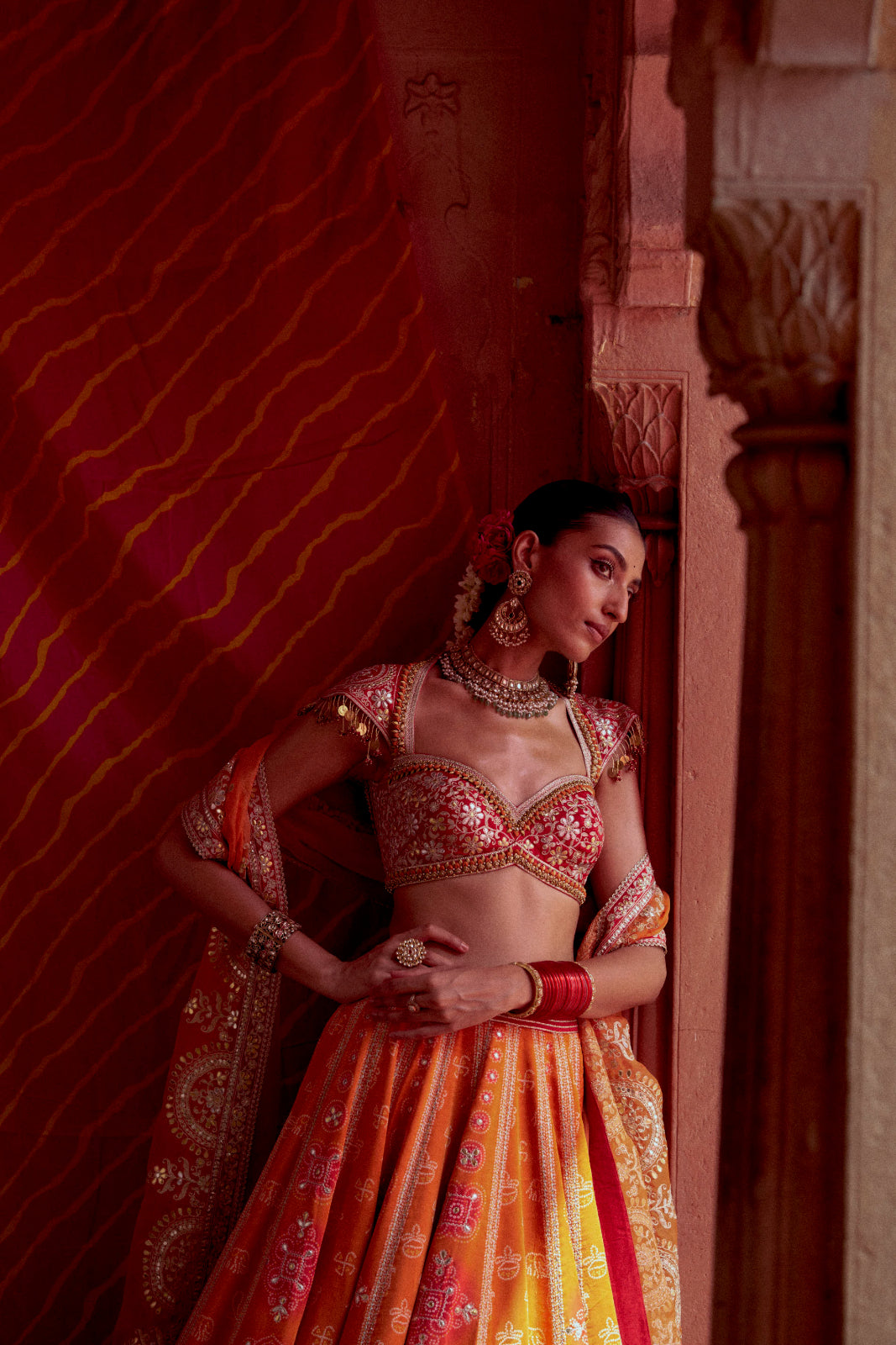 Rediant orange and red printed bandhej gota patti lehenga set