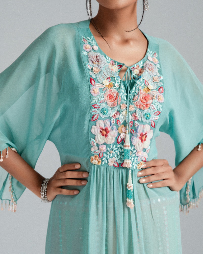 Georgette kaftan paired with mirror work trousers.