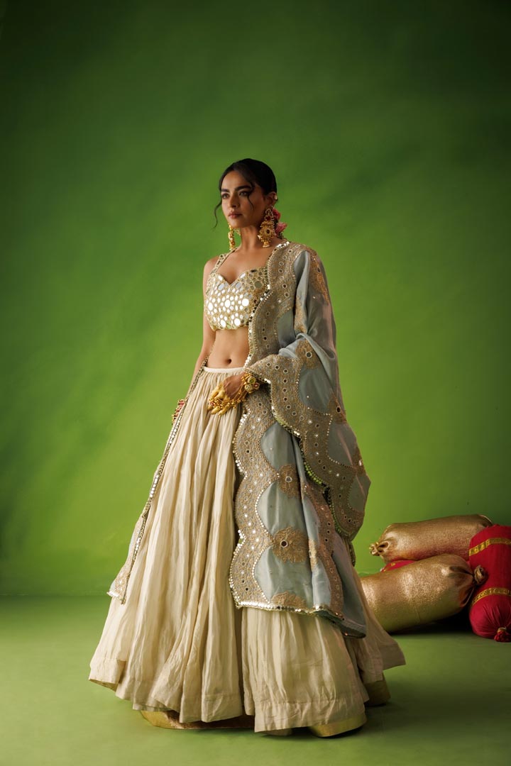 Beige crushed tissue lehenga set with blue dupatta