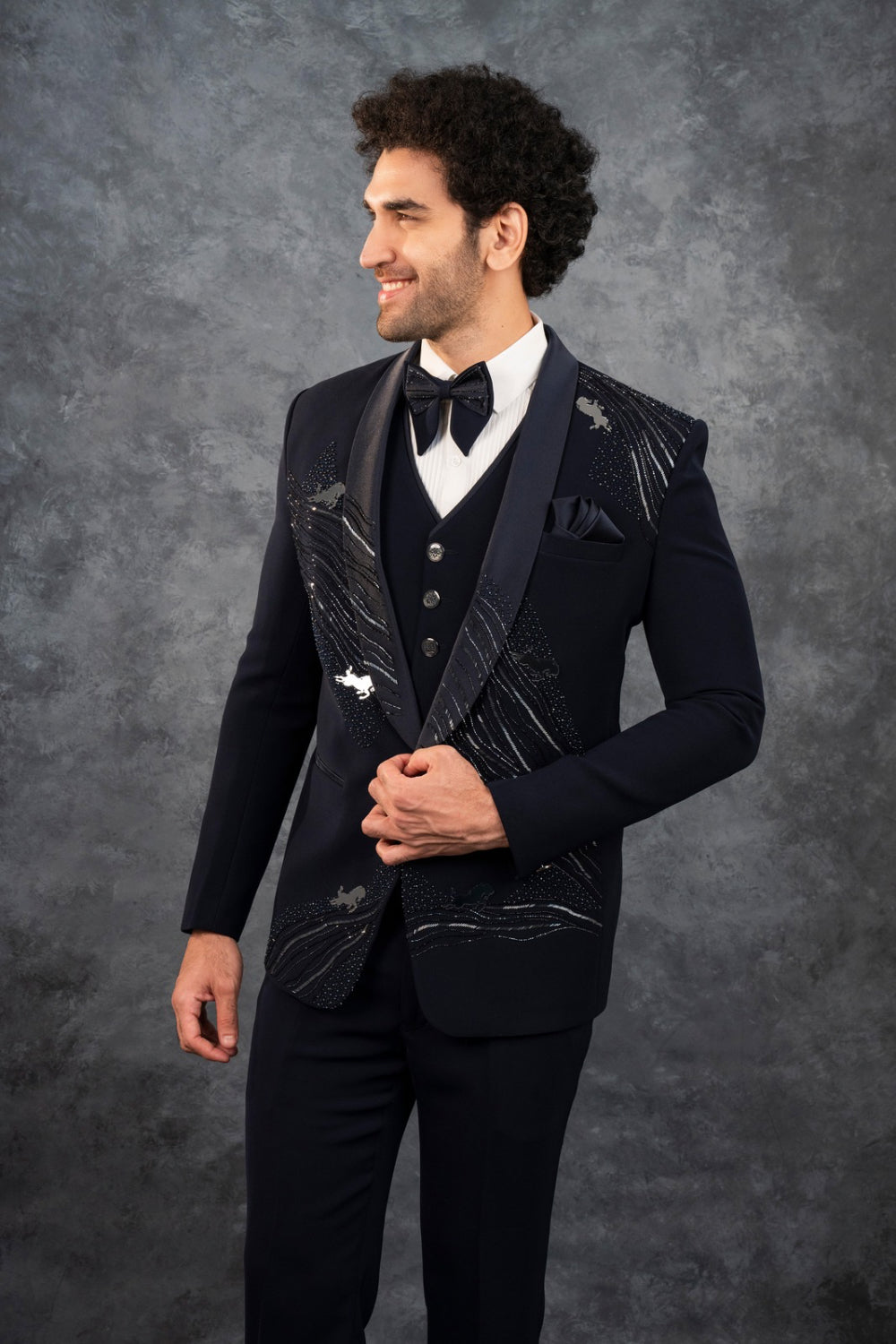 Black splendid silk tuxedo with hand cut dana and stone work