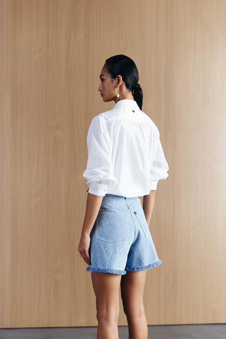 WASHED DENIM STUDDED SHORTS