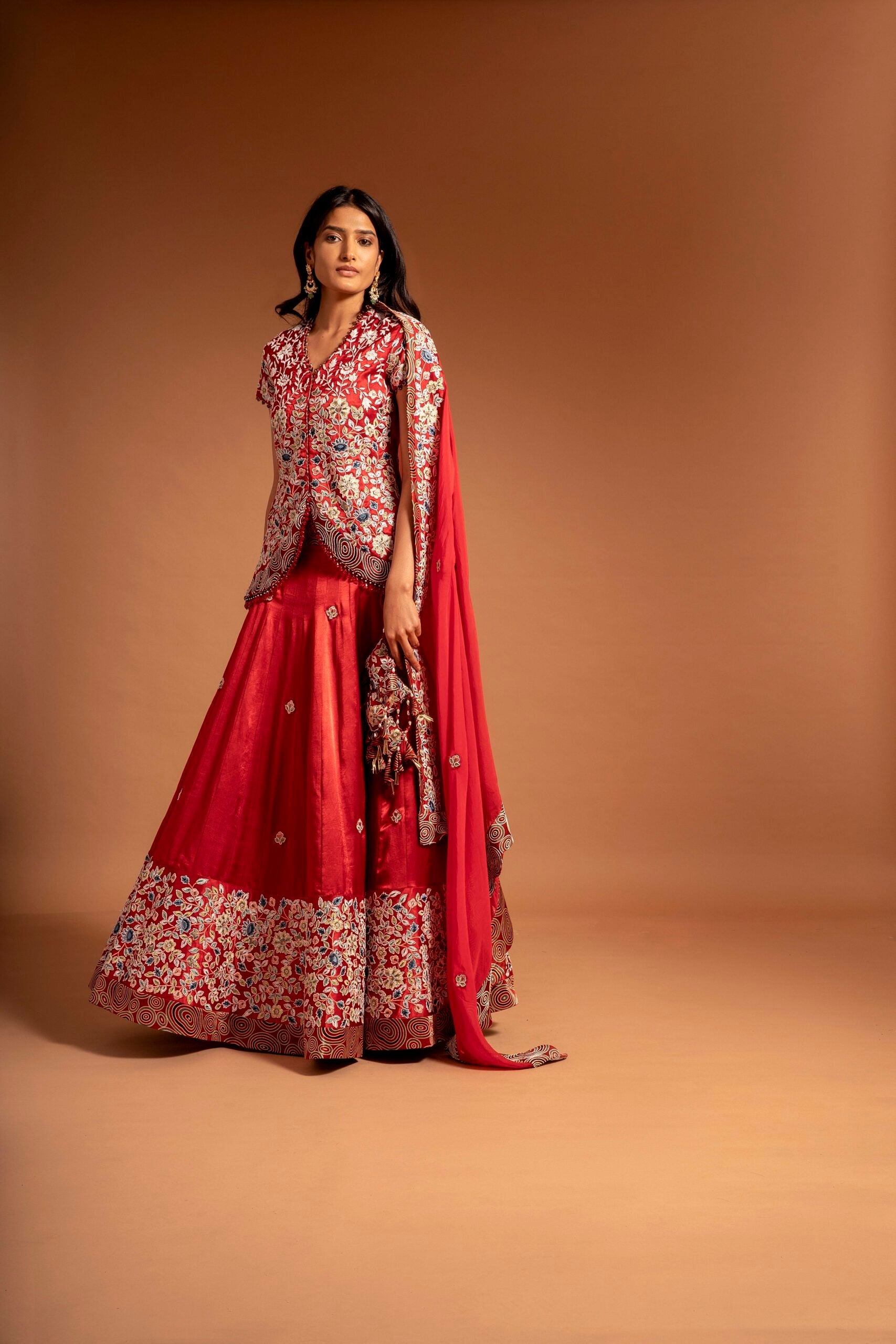 Red fully handcarfted jacket with lehenga and cape dupatta