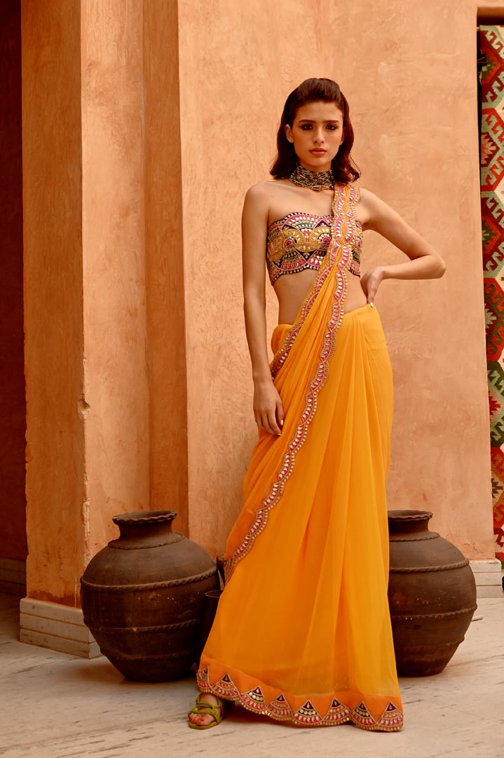 Image of Mango yellow saree with pre-stitched palla and pleats  with bejewelled bandeau blouse