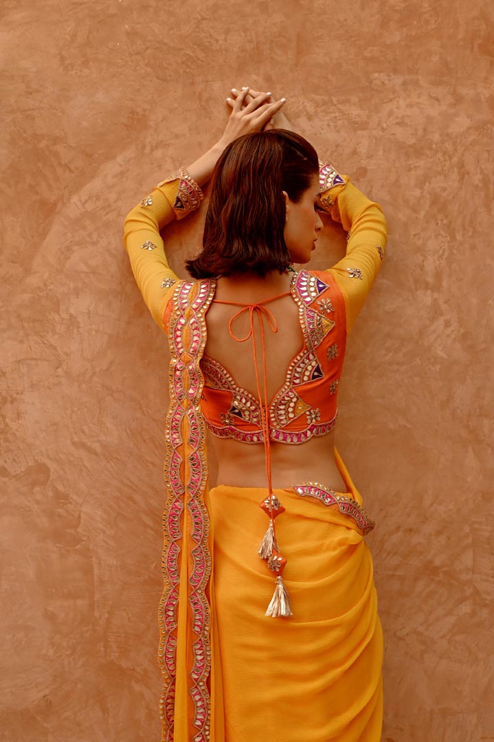 Image of Mango yellow saree with pre-stitched palla and pleats  with bejewelled jaal full sleeve blouse