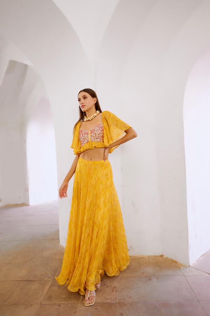 Image of Gulbahar Marigold yellow  jugnu sitara butterfly blouse with flair skirt set.