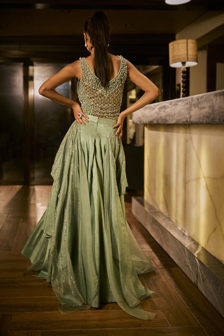 Mint green lehenga set with an embellished blouse