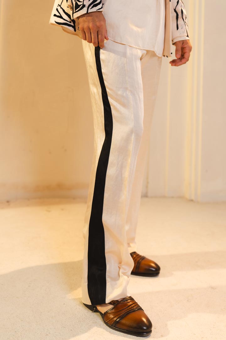 Kurta set in Pearl Ash with black detailing.