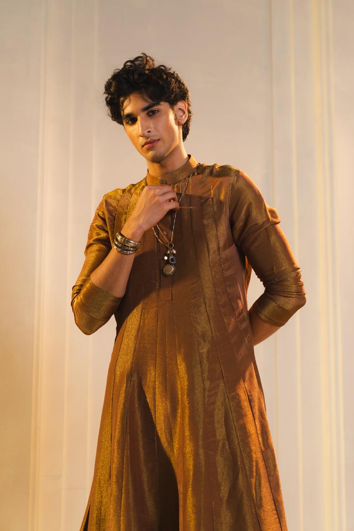 Anarkali kurta in gold, paired with flared trousers.