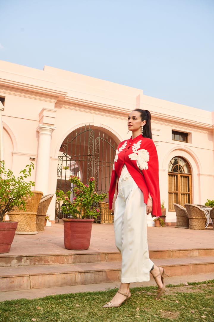 red and white embroidered cape