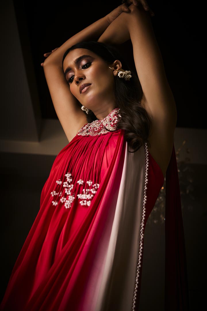 A sangria silk satin pre-draped saree gown with intricate neckline embroidery.