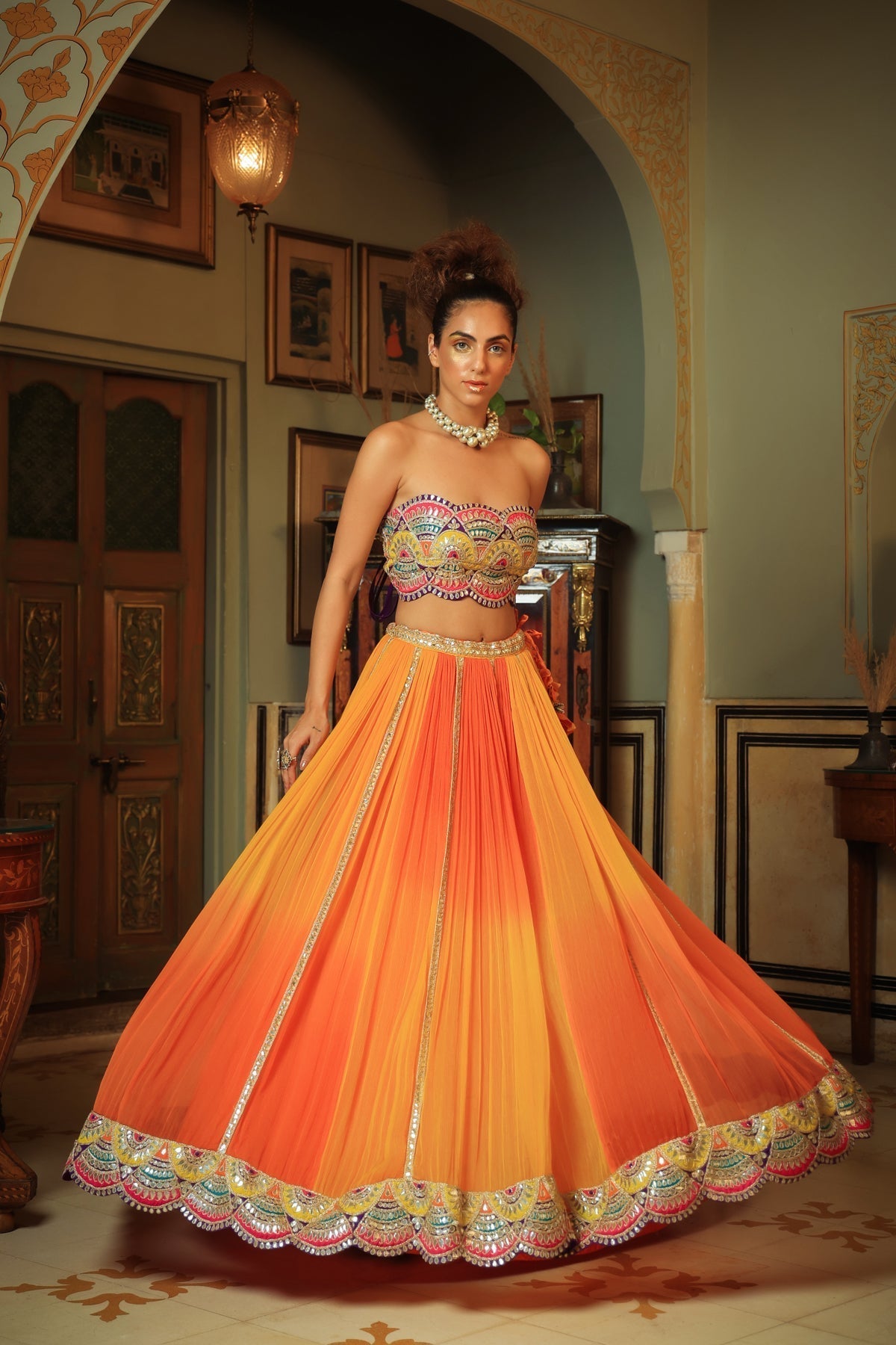 Image of Dilruba bejewelled gotapatti bandeau blouse and sunset ombre lehenga and scalloped shrug set