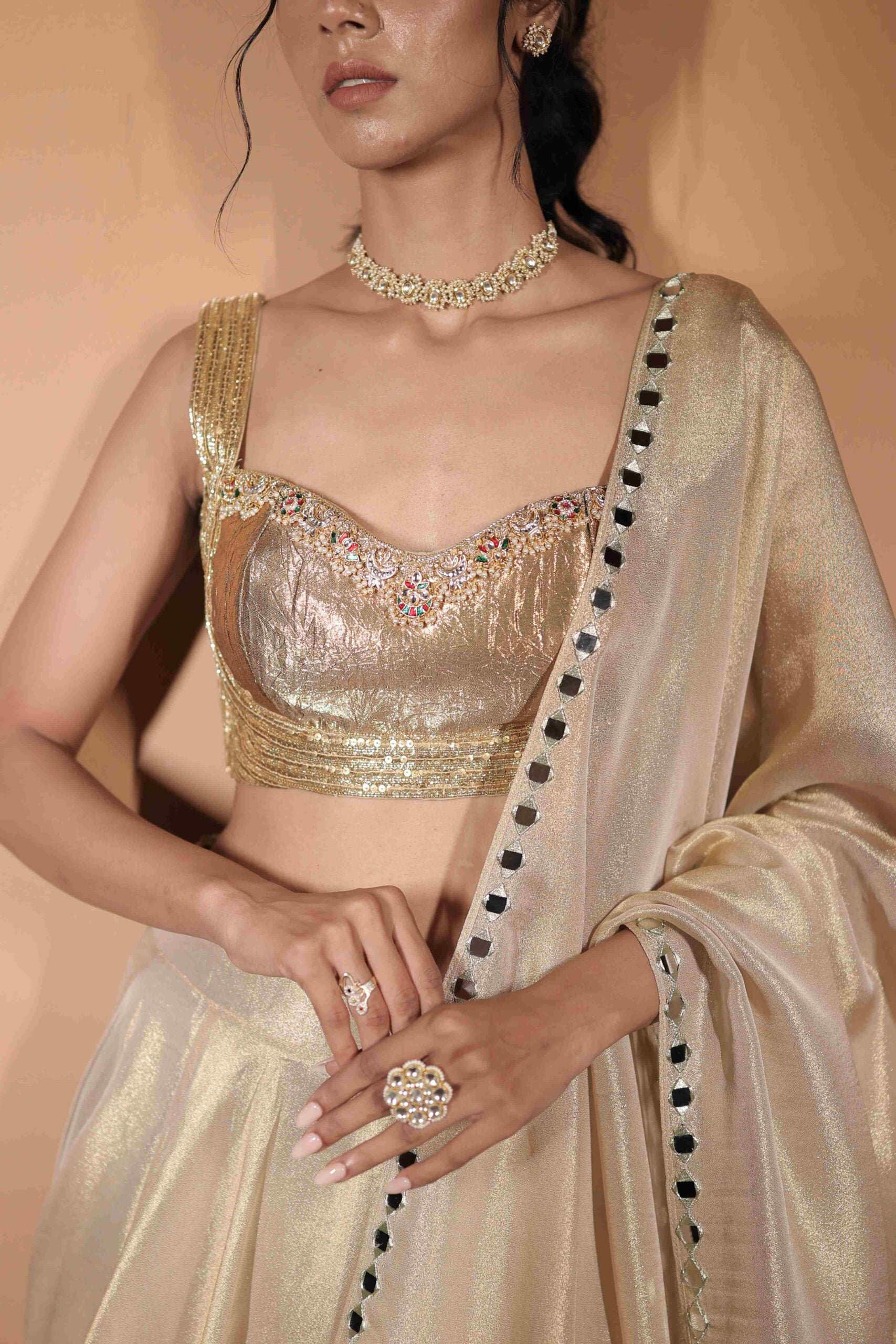The " Son Pari " lehenga set / Ivory-gold jewel and mirror embroidered tissue lehenga set