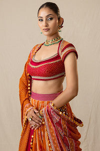 Radiant orange and red printed bandhej lehenga set