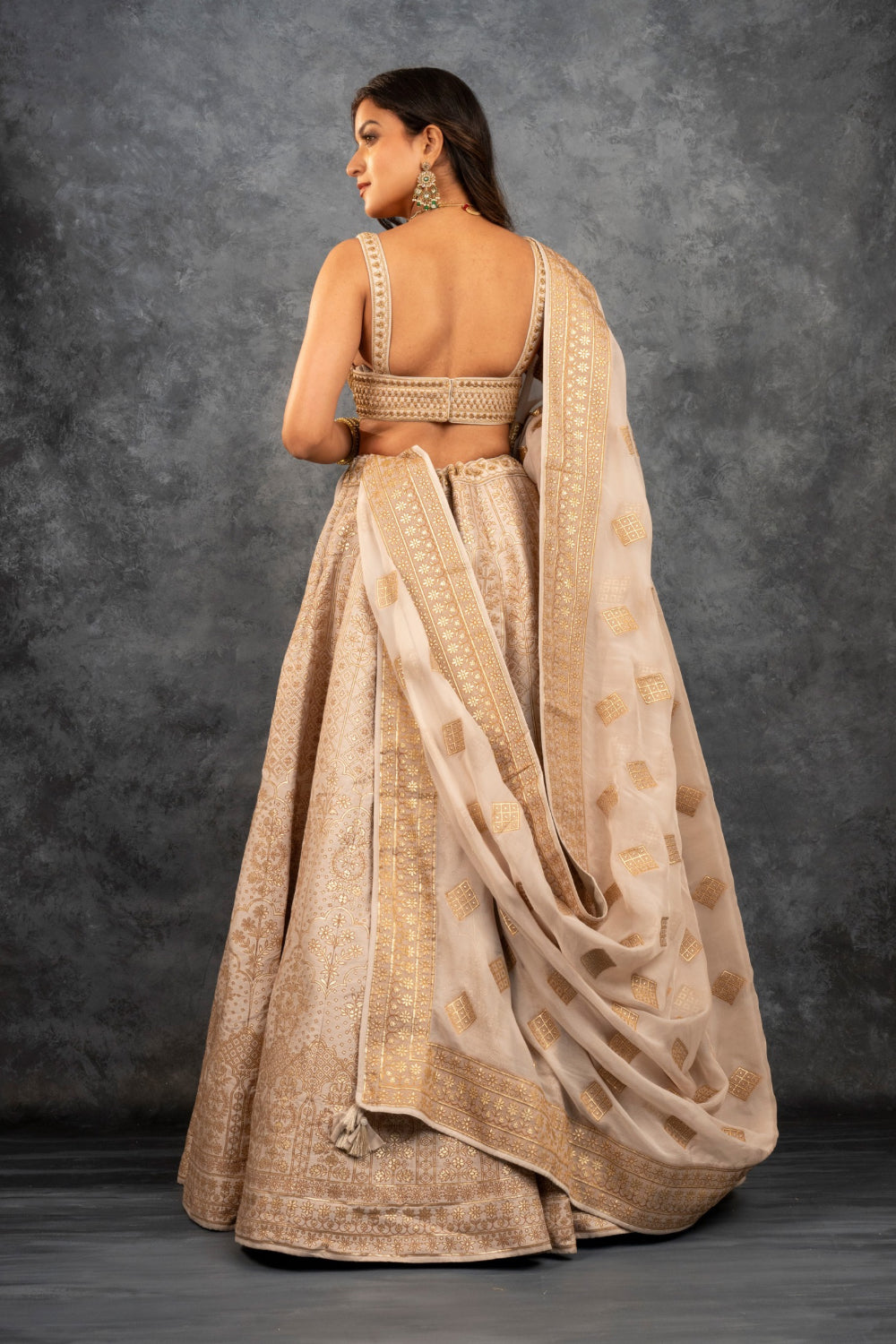 Beige banarasi silk lehenga choli with sequins, hand cut dana and dori work