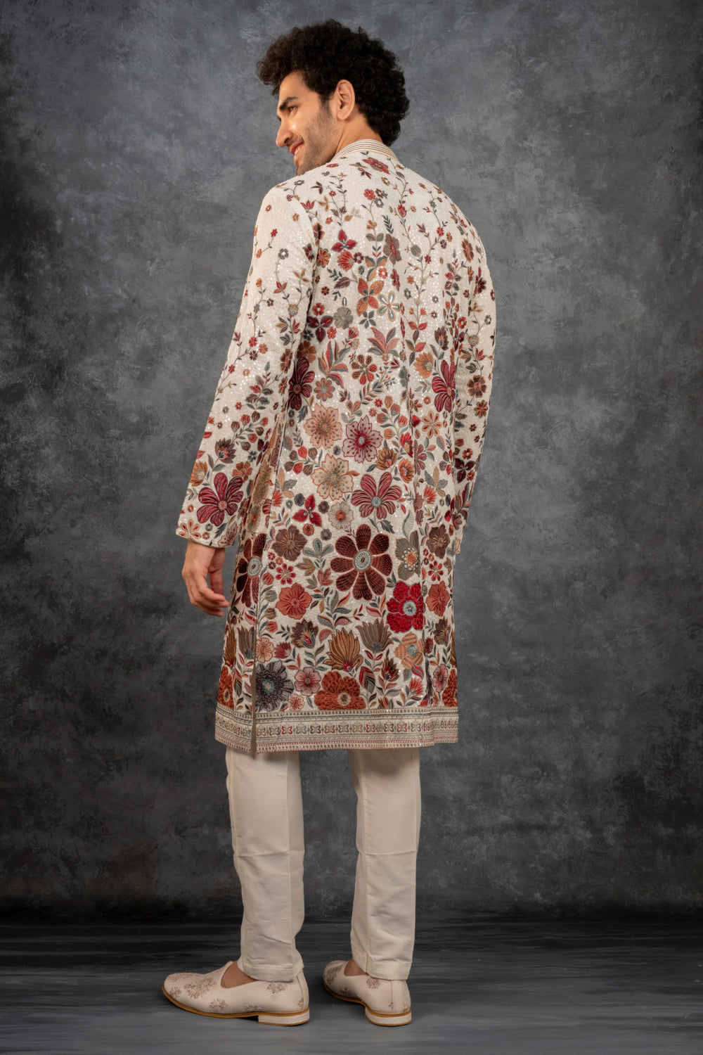 Beige silk kurta set with multicolour resham embroidery and sequins work