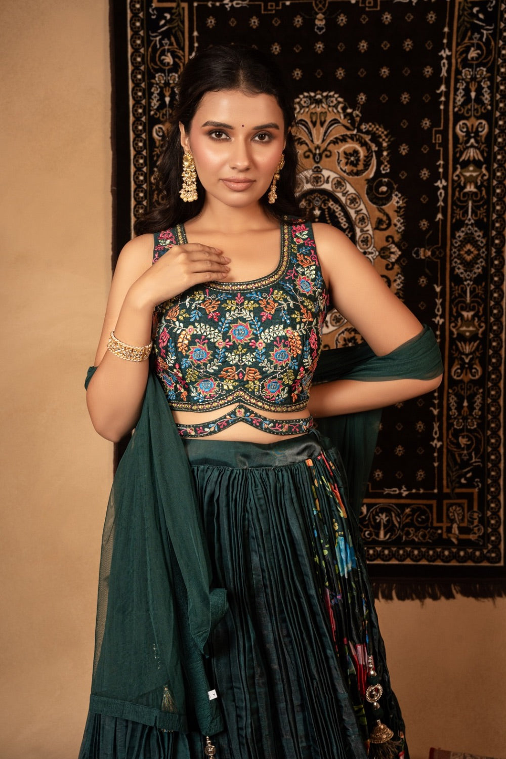 Dark green silk lehenga choli with resham and mirror work