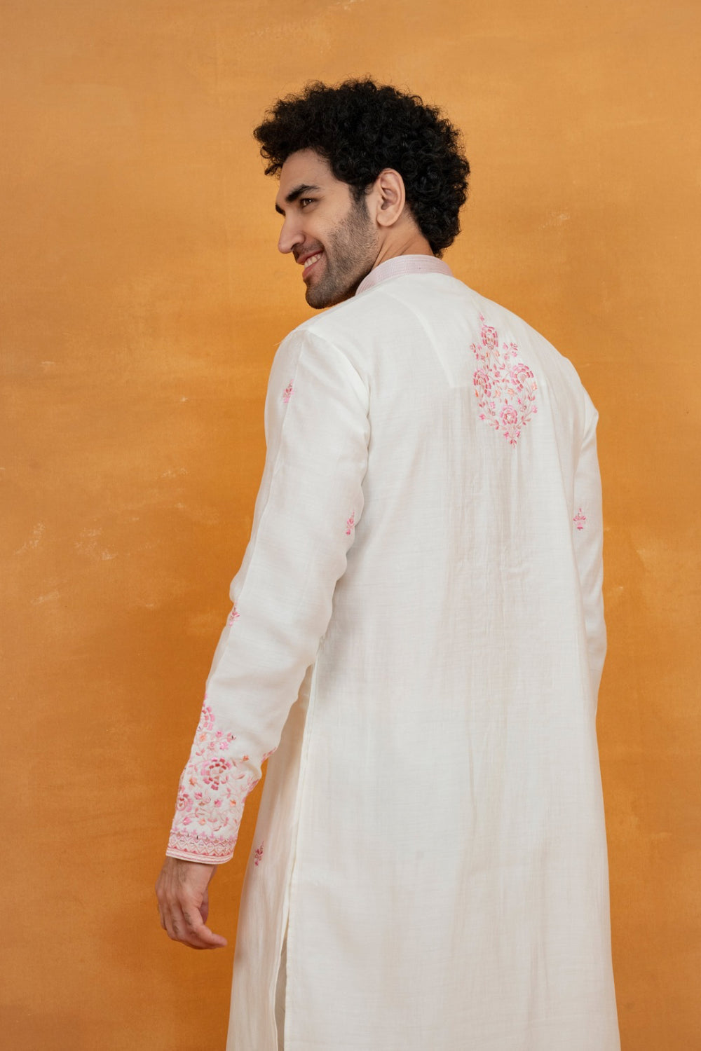 Cream silk kurta set with pink resham embroidery and mirror work