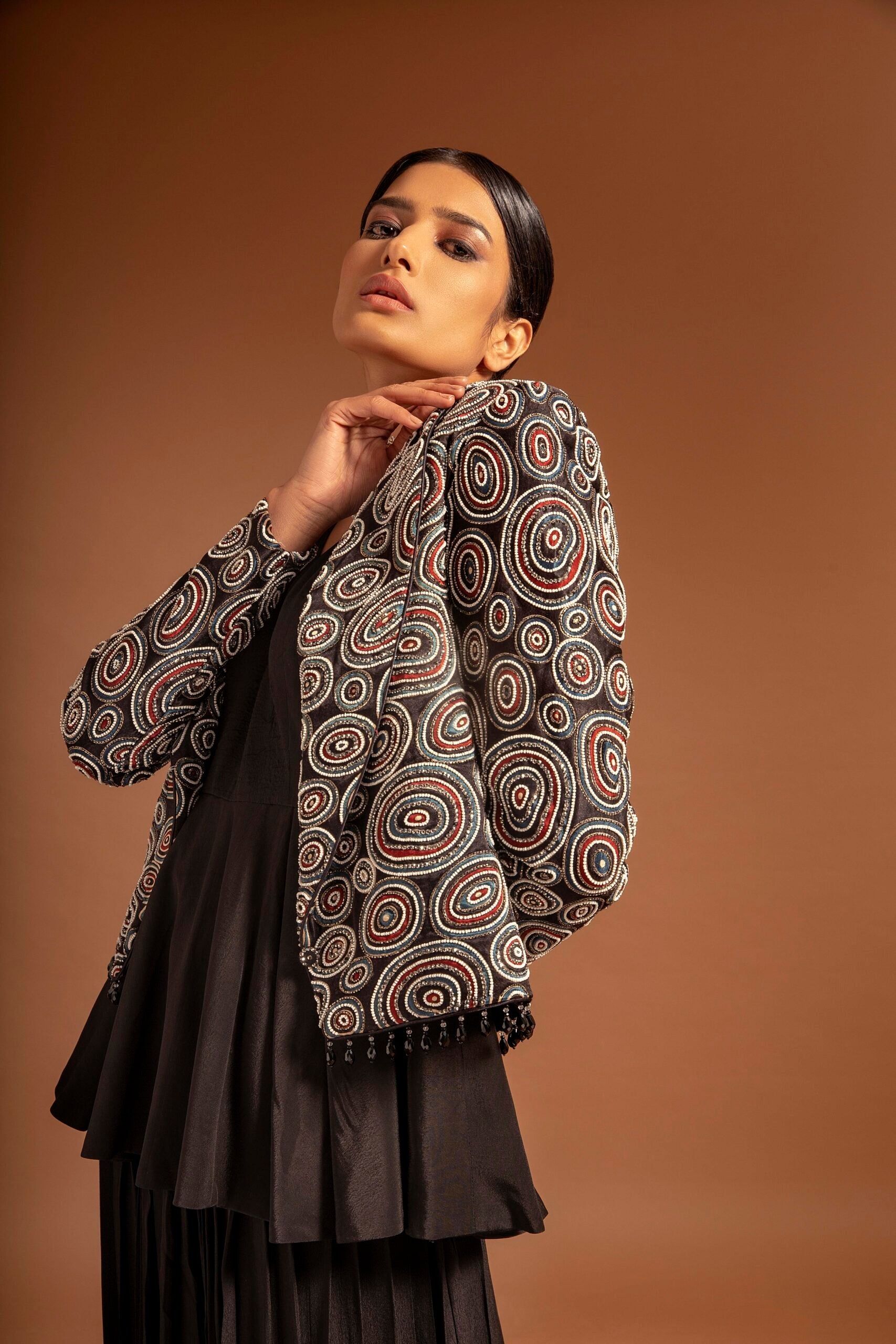 Black fully embroidered jacket with peplum top and pleated pants