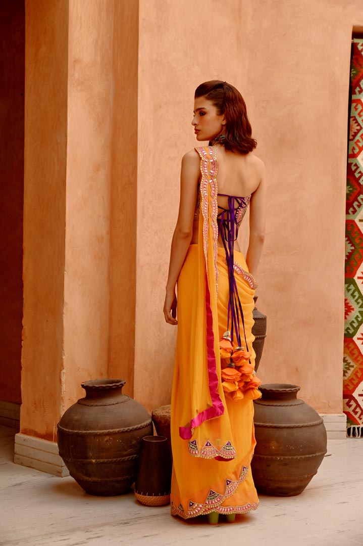 Image of Mango yellow saree with pre-stitched palla and pleats  with bejewelled bandeau blouse