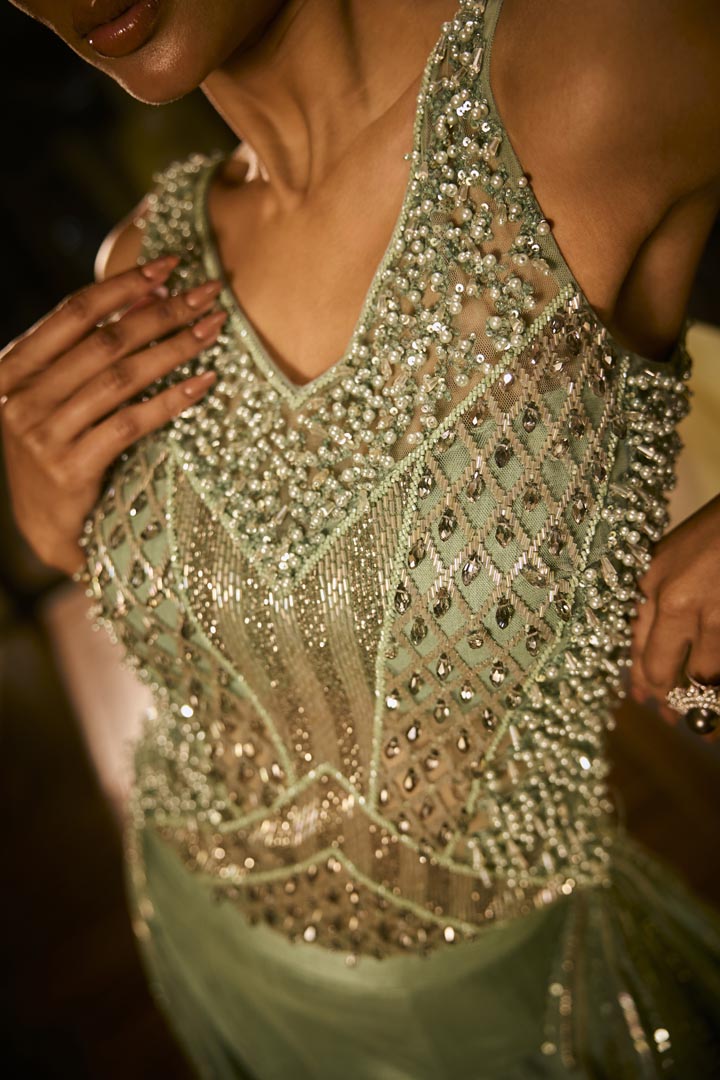 Mint green lehenga set with an embellished blouse