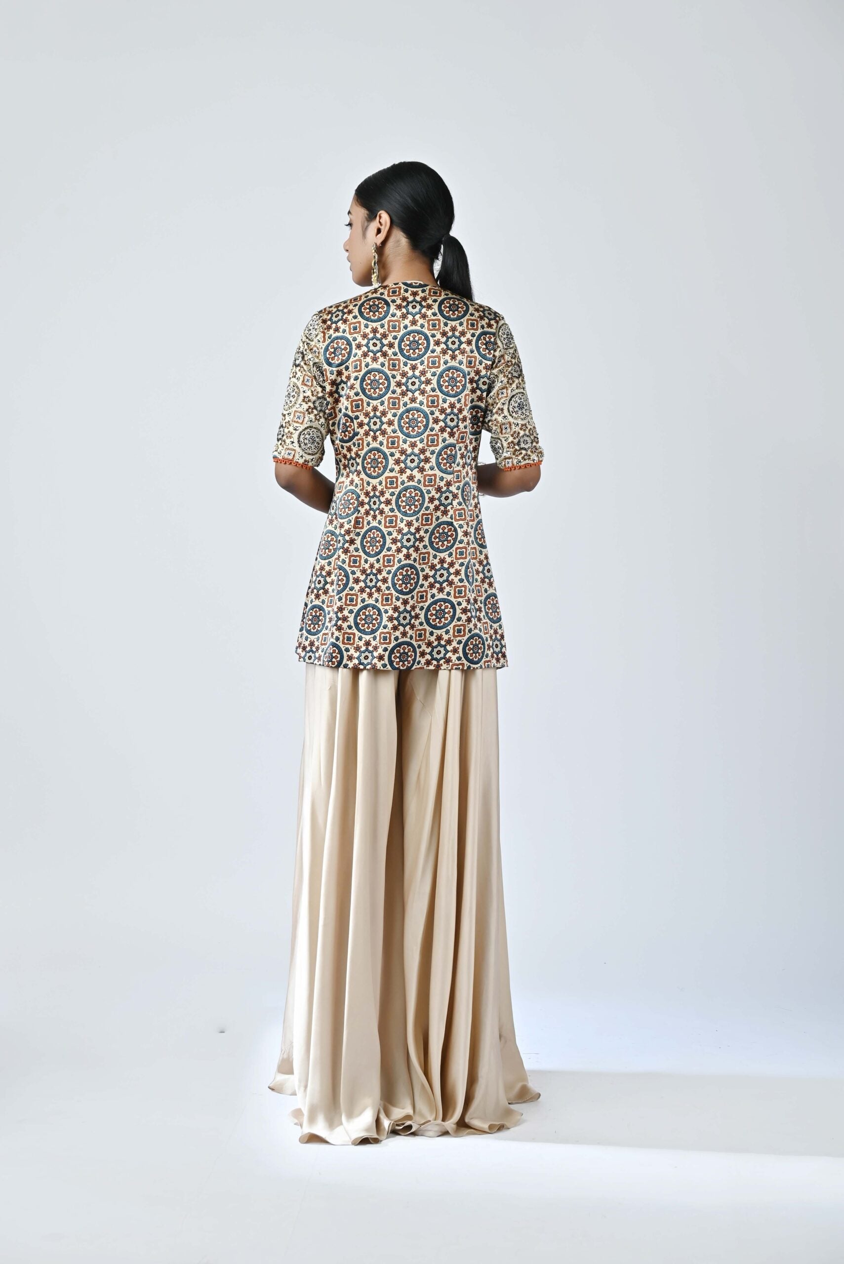 Beige embroidered jacket with flare pants