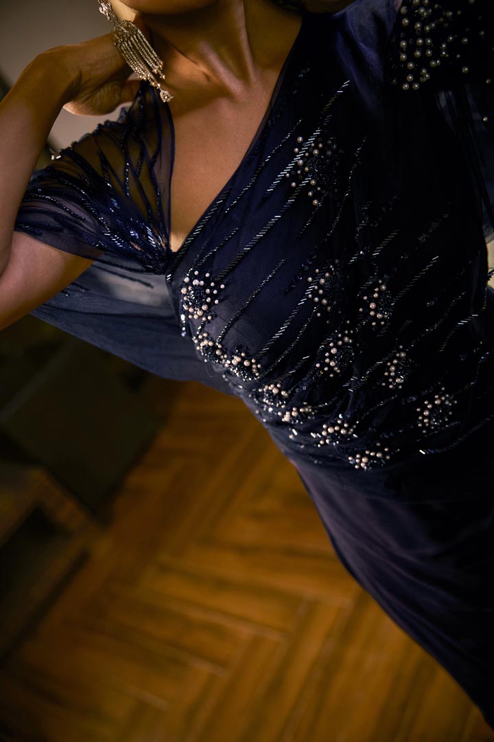 Midnight Blue jumpsuit with sheer sleeve and draped silhouette