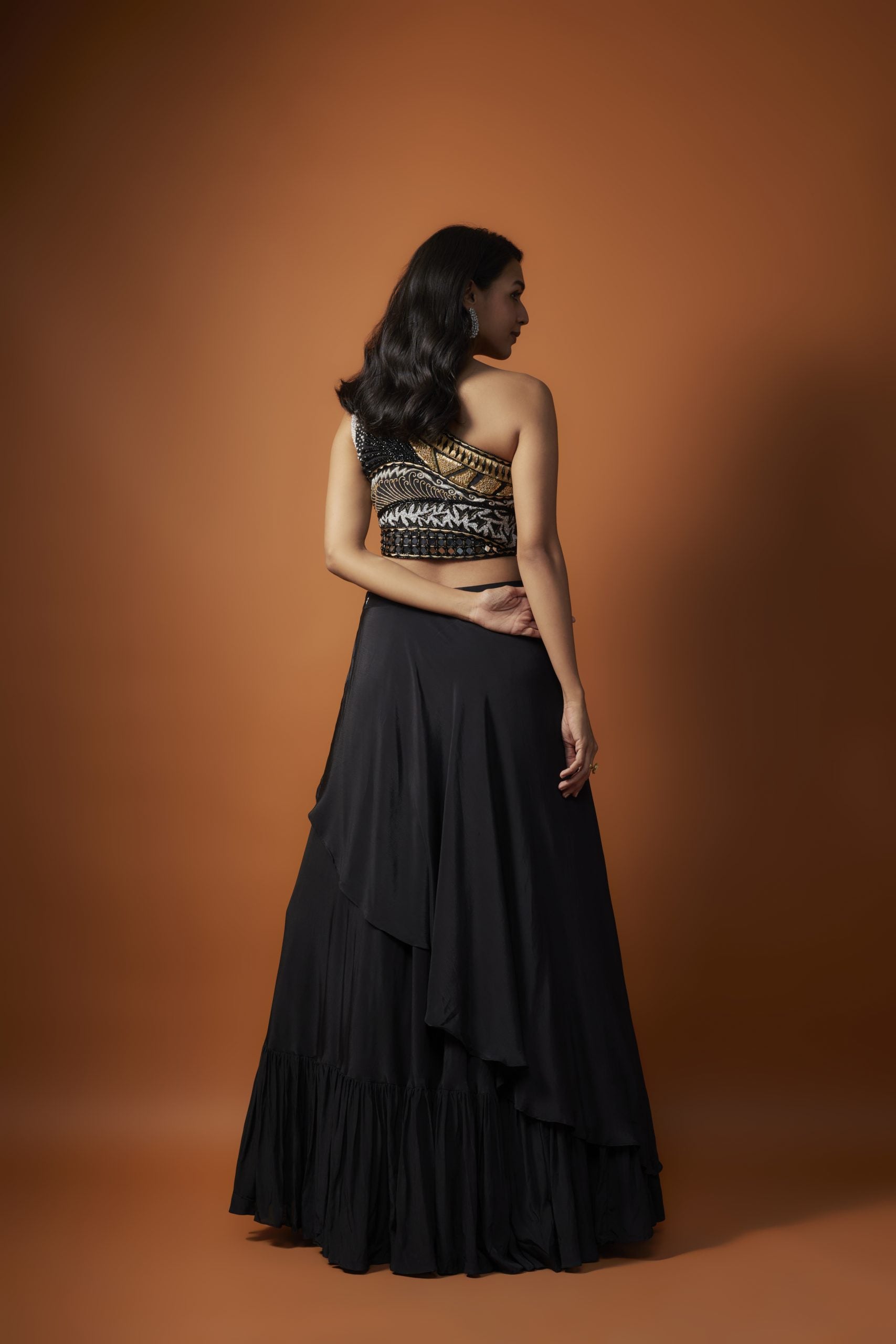 Image of BLACK ONE SHOULDER EMBROIDERED CHOLI WITH ASYMMETRICAL LEHENGA SET