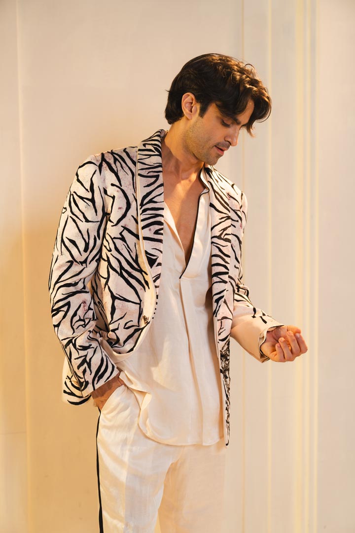 Concept blazer with hand paint and hand embroidery. paired with a matching kurta and trousers.
