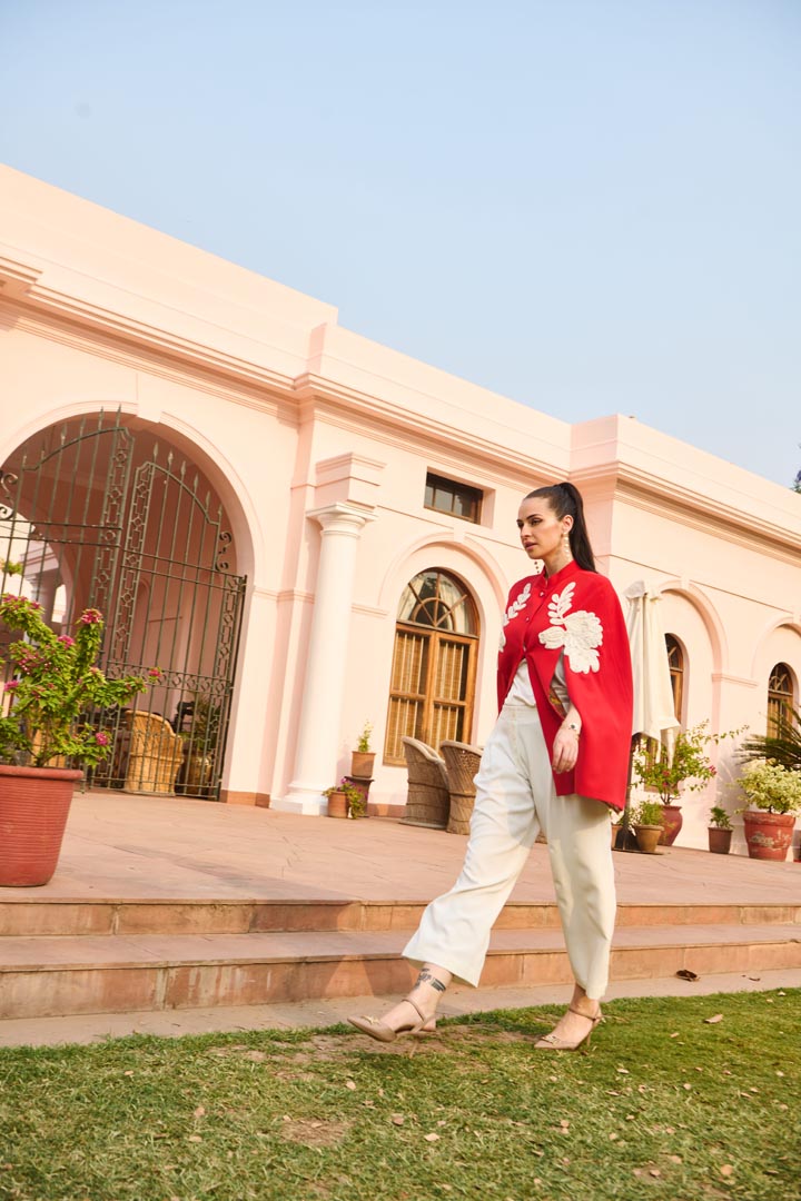 red and white embroidered cape
