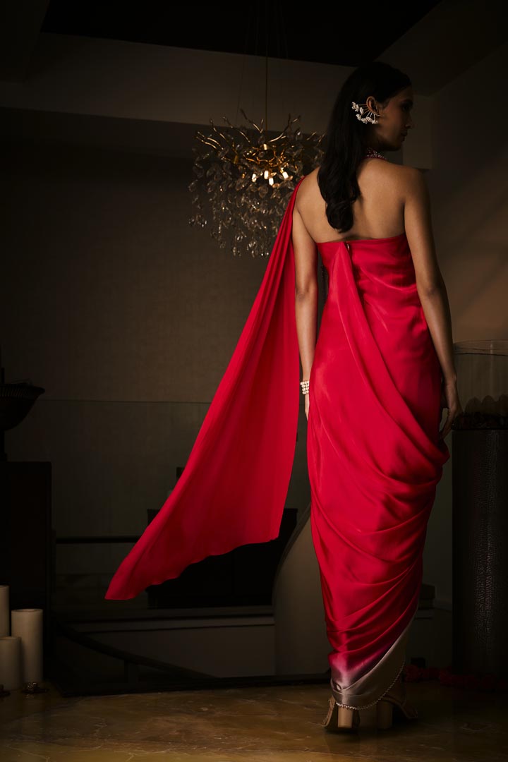 A sangria silk satin pre-draped saree gown with intricate neckline embroidery.
