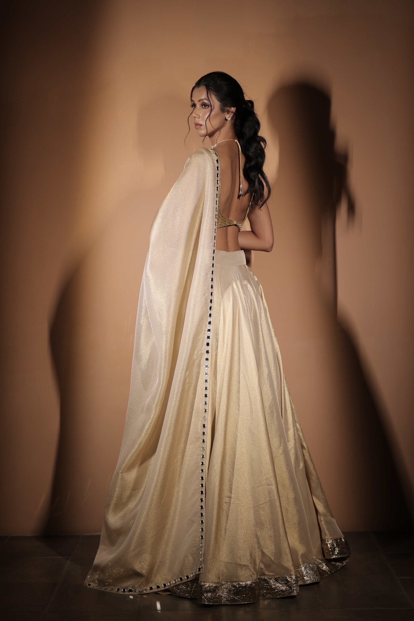 The " Son Pari " lehenga set / Ivory-gold jewel and mirror embroidered tissue lehenga set