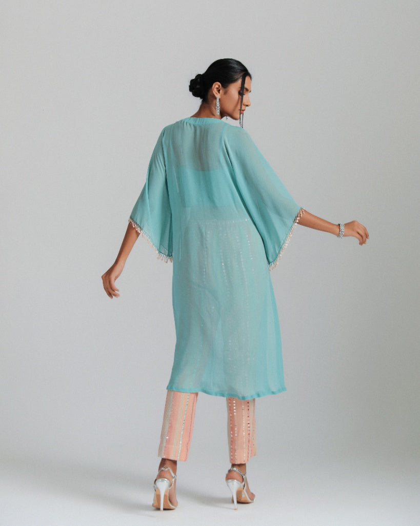 Georgette kaftan paired with mirror work trousers.