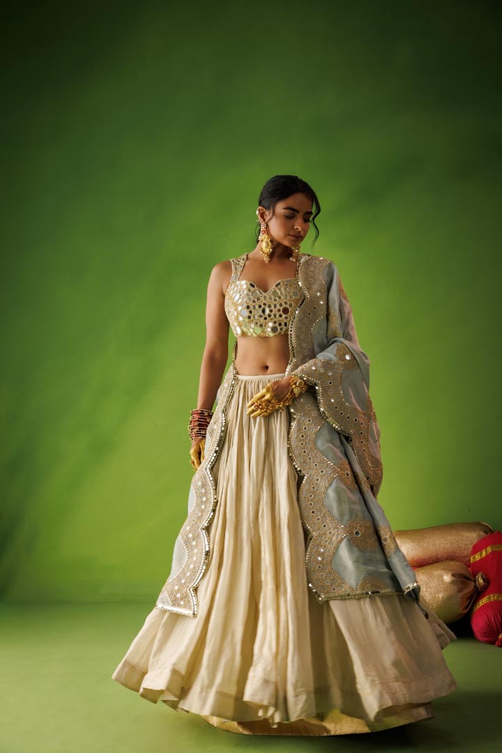 Beige crushed tissue lehenga set with blue dupatta