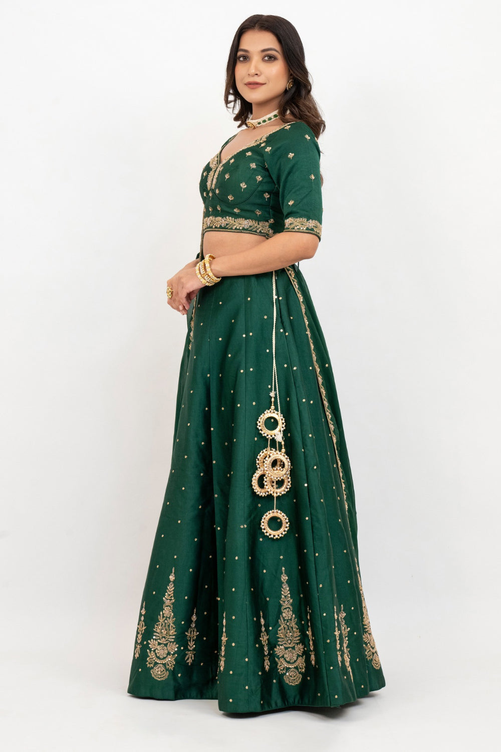 Bottle green soft silk zardozi embroidered lehenga choli with hand cut dana work