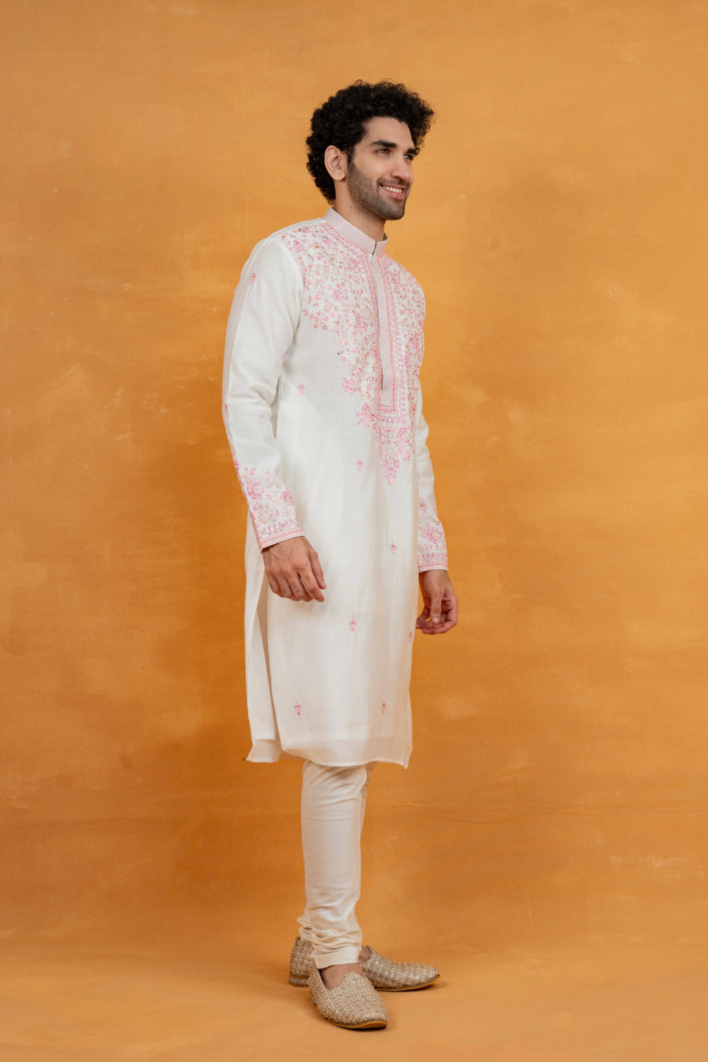 Cream silk kurta set with pink resham embroidery and mirror work