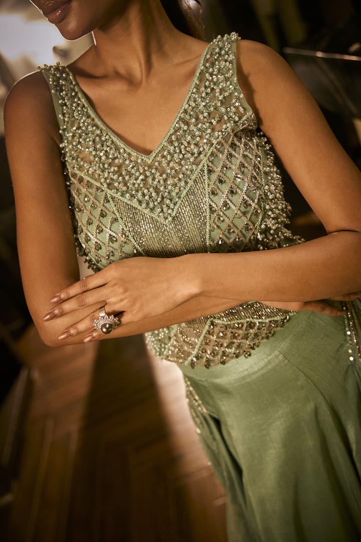 Mint green lehenga set with an embellished blouse