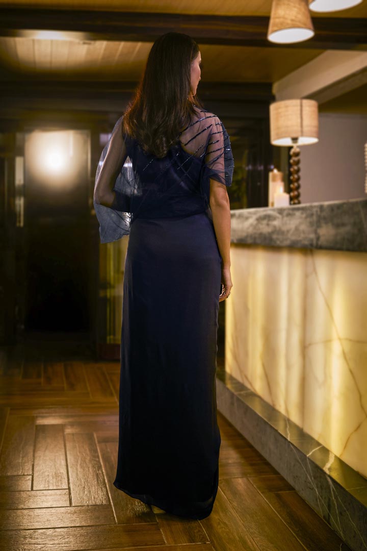 Midnight Blue jumpsuit with sheer sleeve and draped silhouette