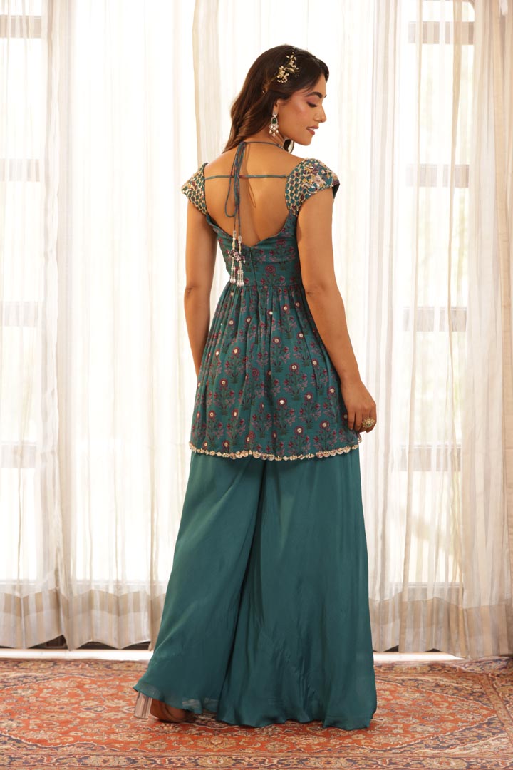 Image of Double neck hand embroidered peplum, Paired with Flared pant and net dupatta