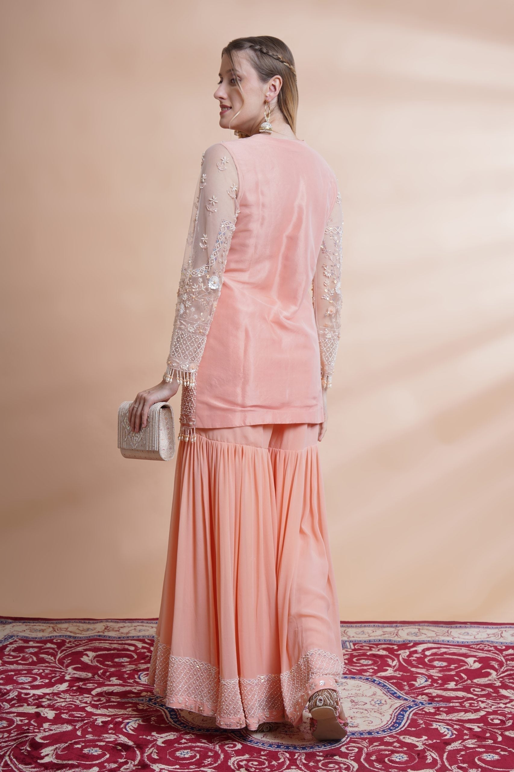 Image of Peach net kurta sharara set