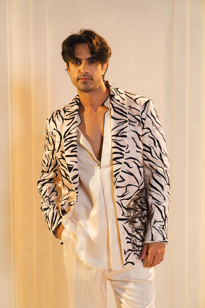 Concept blazer with hand paint and hand embroidery. paired with a matching kurta and trousers.