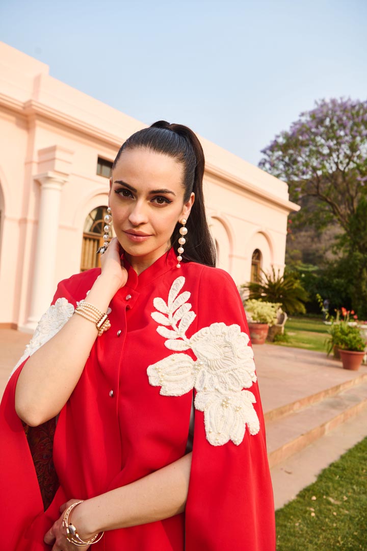 red and white embroidered cape