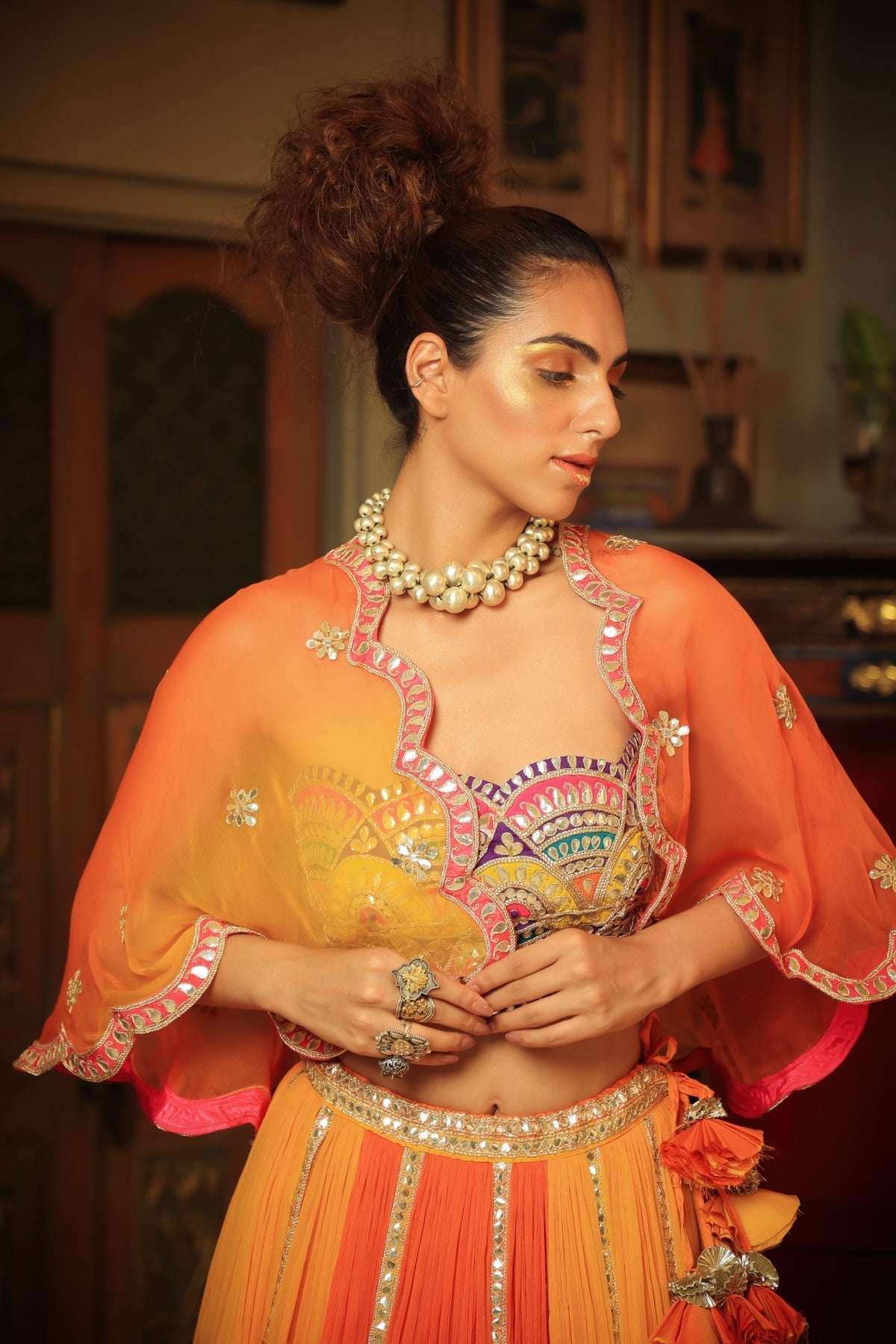 Image of Dilruba bejewelled gotapatti bandeau blouse and sunset ombre lehenga and scalloped shrug set