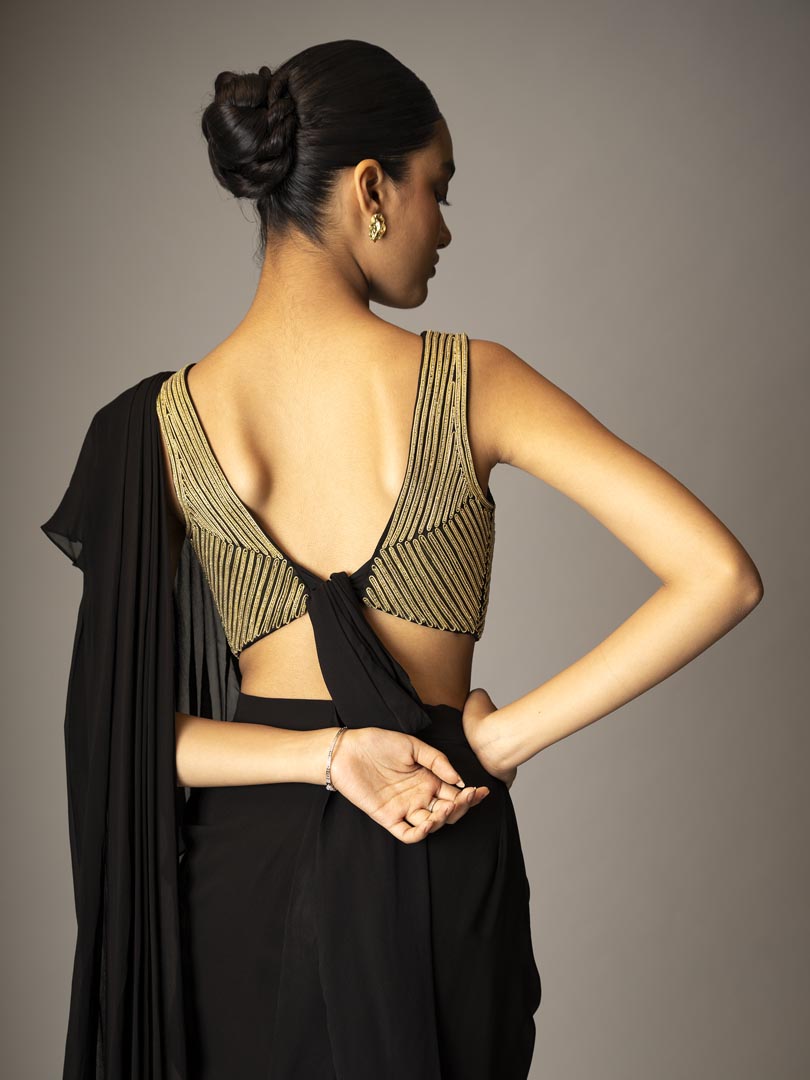 Black pre-draped saree gown
with metallic 3D dori Embellished blouse.
