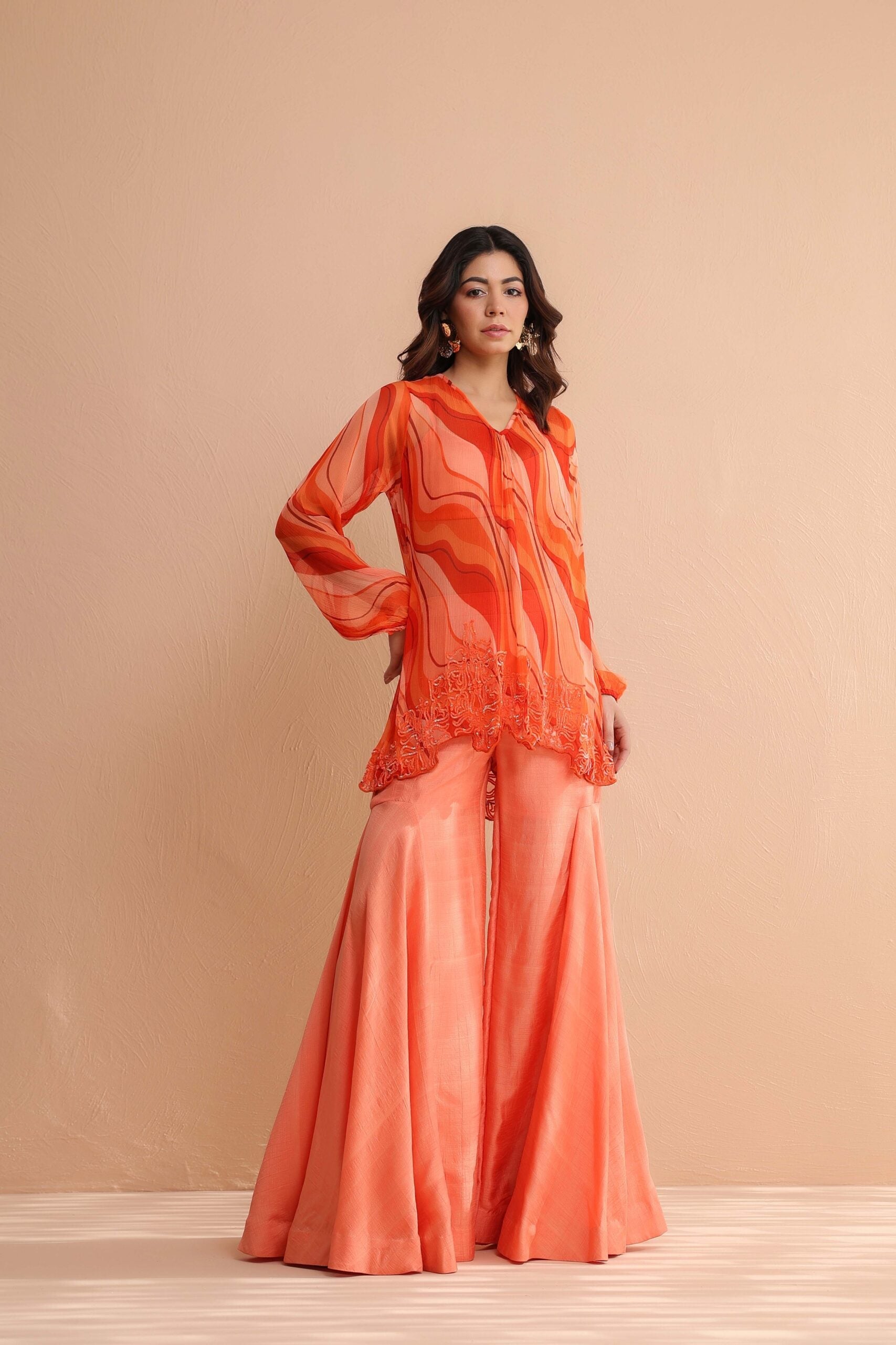 Tequila sunrise tunic with exaggerated bell-bottoms.