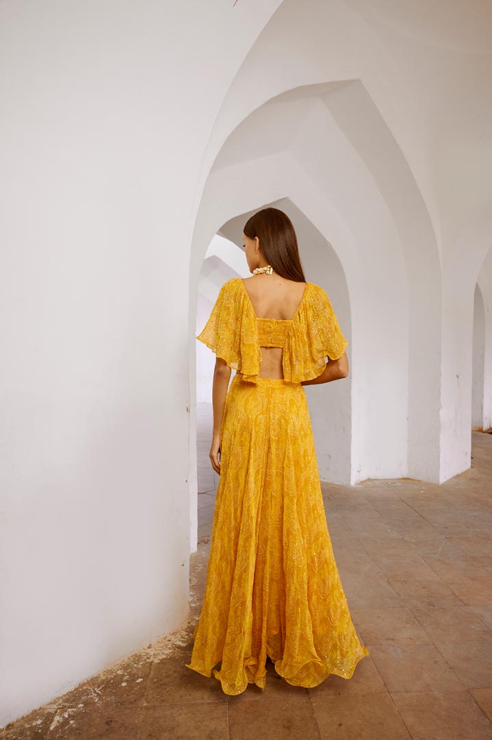 Image of Gulbahar Marigold yellow  jugnu sitara butterfly blouse with flair skirt set.