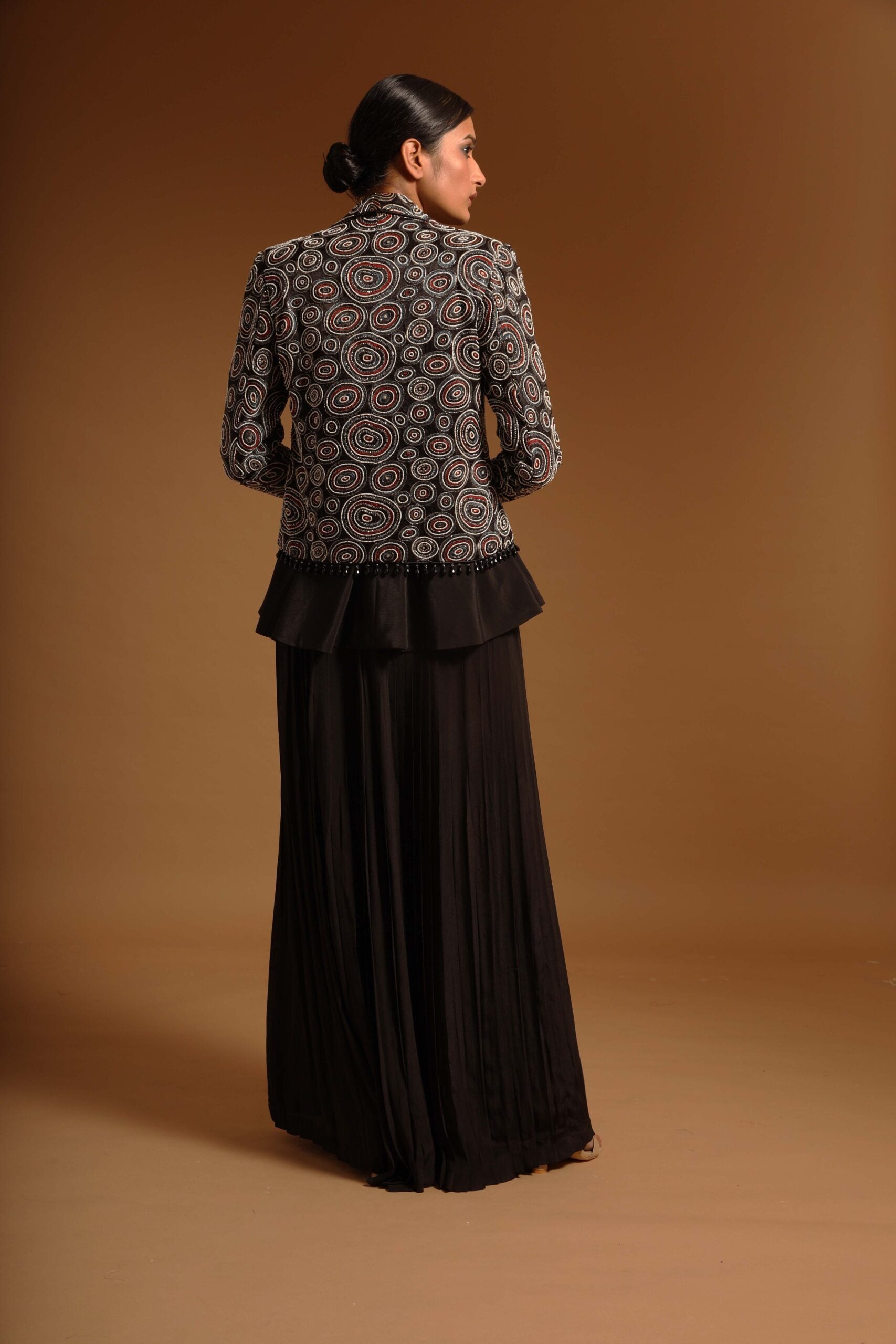 Black fully embroidered jacket with peplum top and pleated pants